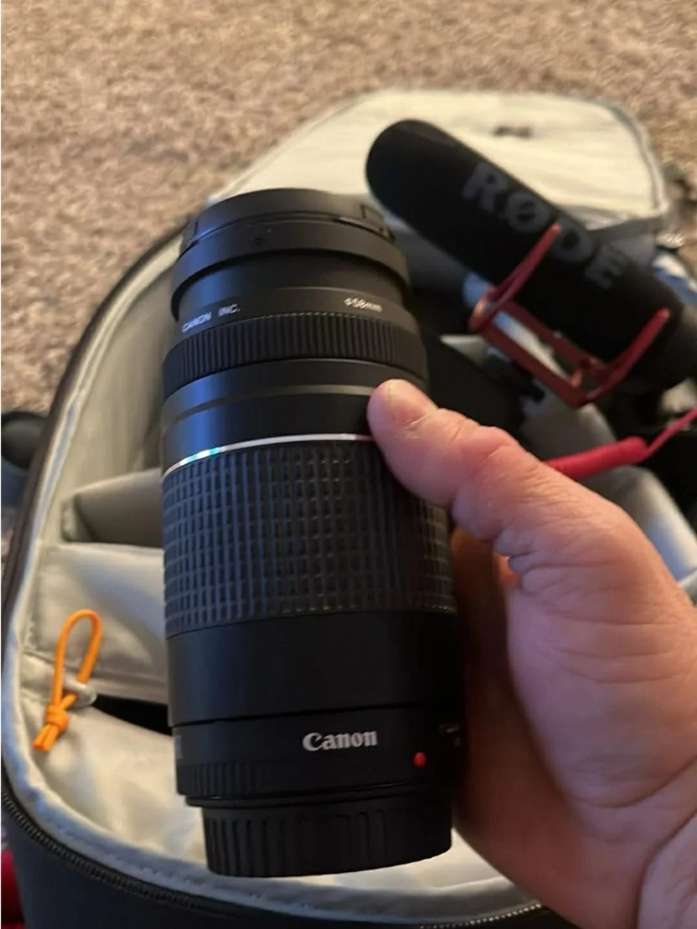 Canon Black DSLR Camera with Rode Microphone and Black Zoom Lens